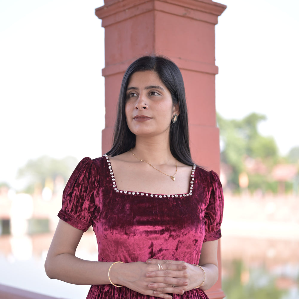 
                      
                        Crimson Square-Neck Velvet Dress with Puff Sleeves.
                      
                    