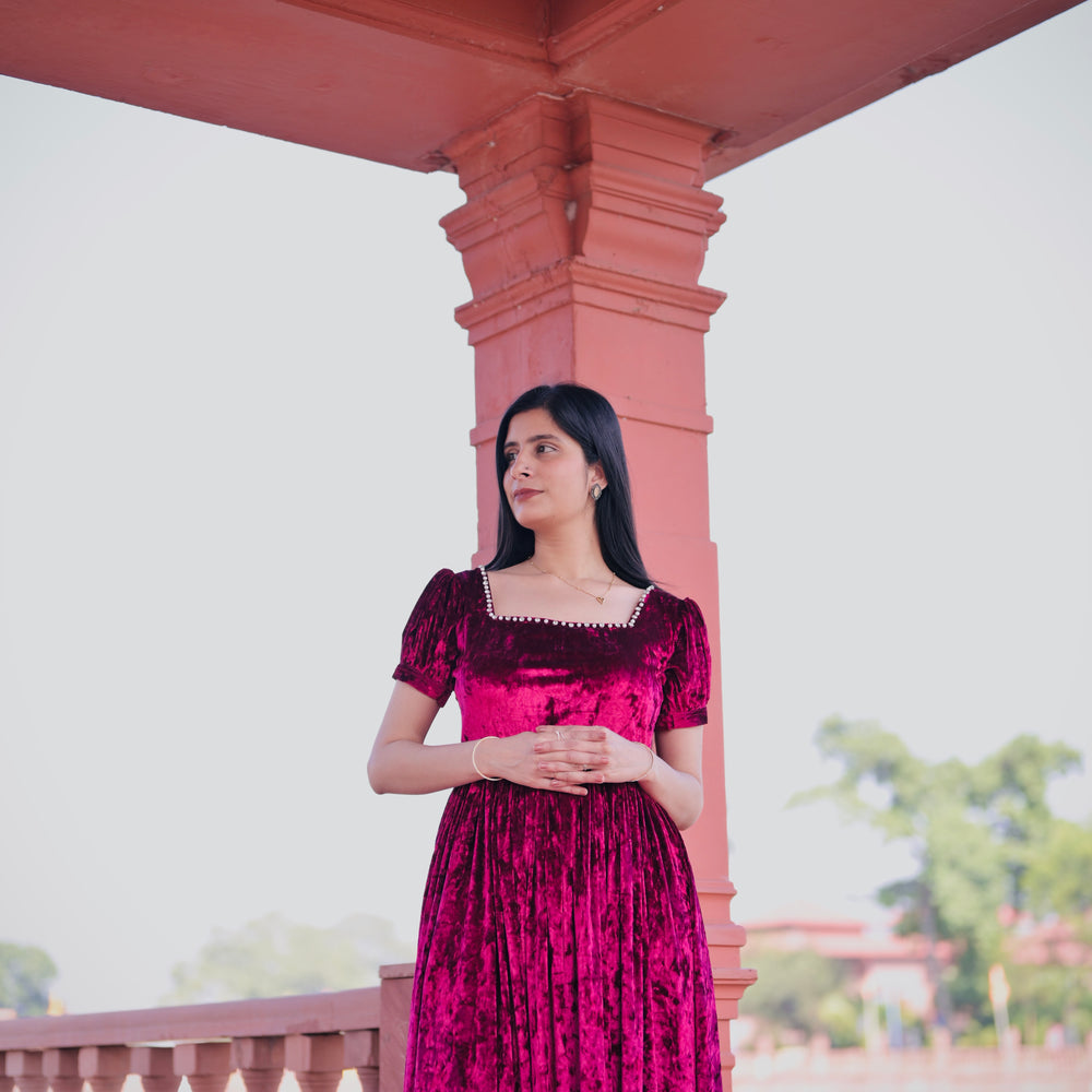 
                      
                        Crimson Square-Neck Velvet Dress with Puff Sleeves.
                      
                    