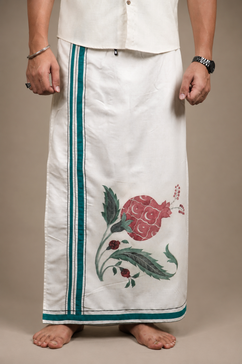 Front close view of pomegranate print lungi with emerald border