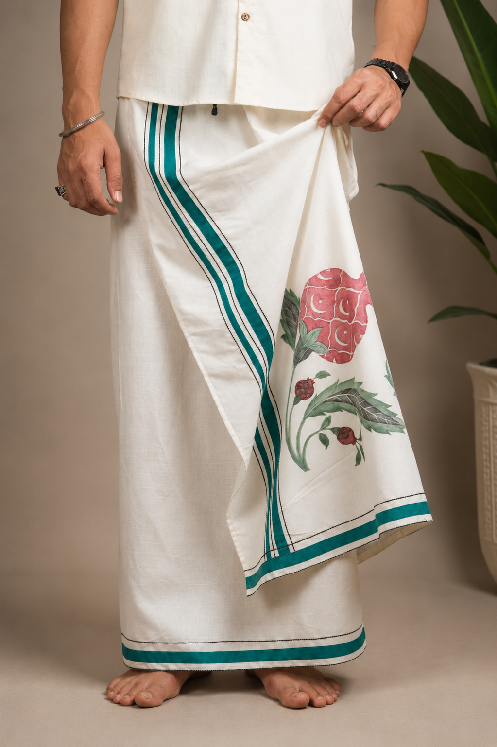 Styled folded view showing pomegranate artwork and emerald border