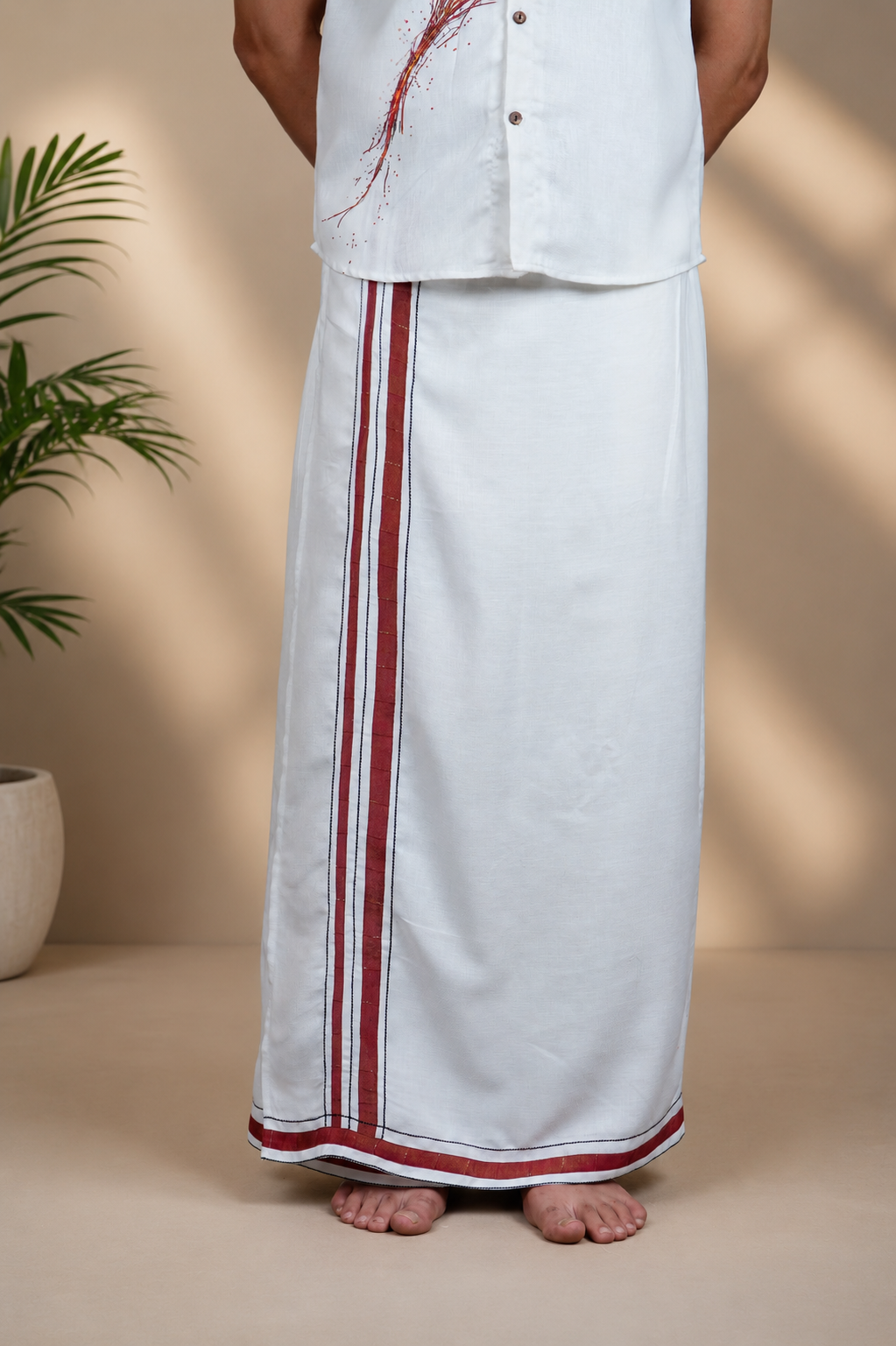 Front view of ivory men's lungi with maroon heritage border