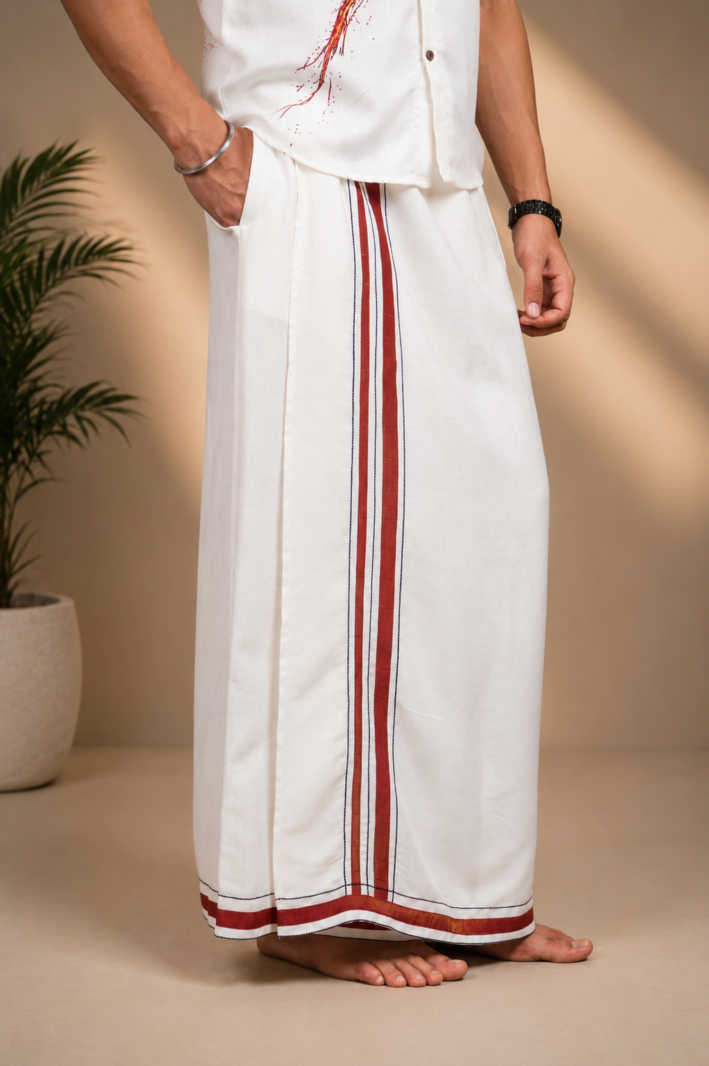 Angled view of ivory men's lungi with maroon vertical stripe