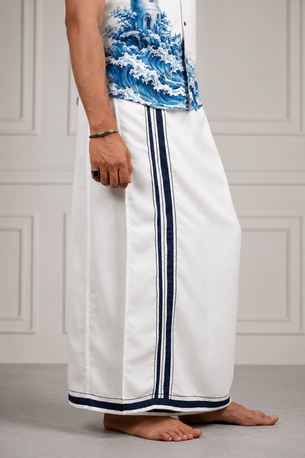 Side view of ivory men's lungi with navy stripe detailing